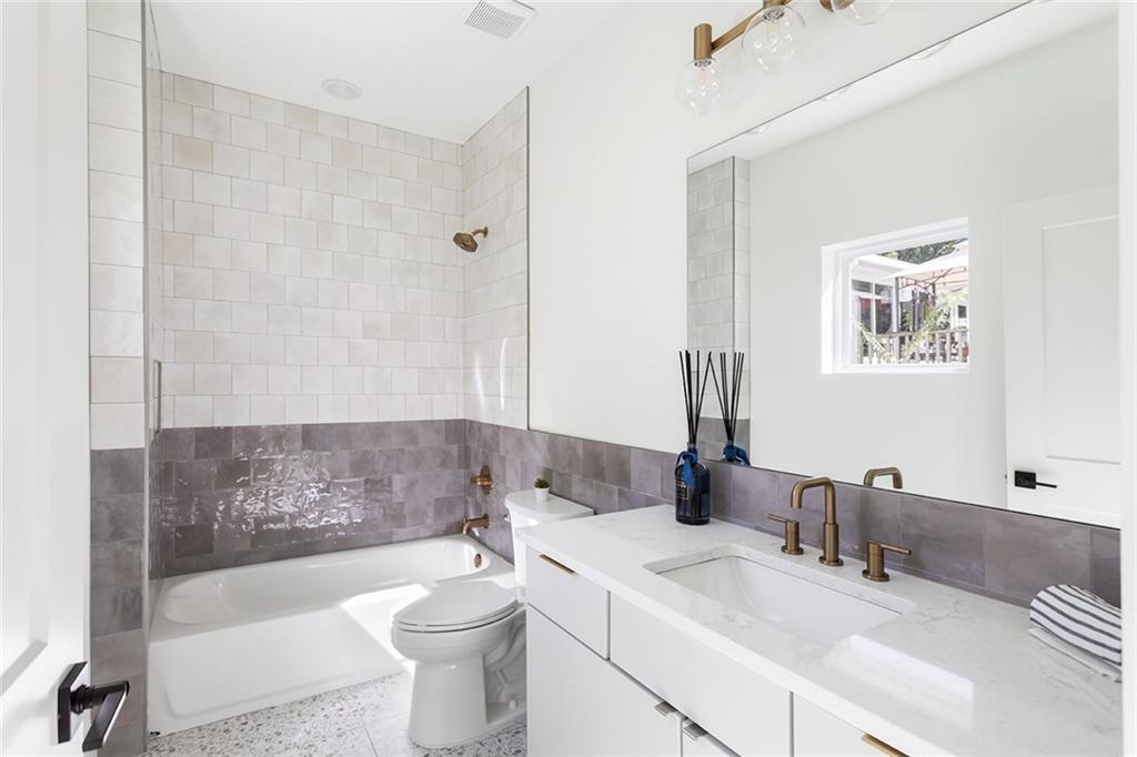 1205 Holly Street Northwest, Unit B Atlanta, GA 30318 - Photo 33 of 81 a bathroom with a sink a toilet and shower