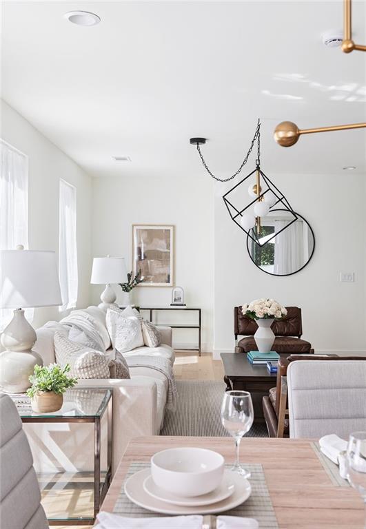 1205 Holly Street Northwest, Unit B Atlanta, GA 30318 - Photo 8 of 81 a living room with furniture a mirror and a window