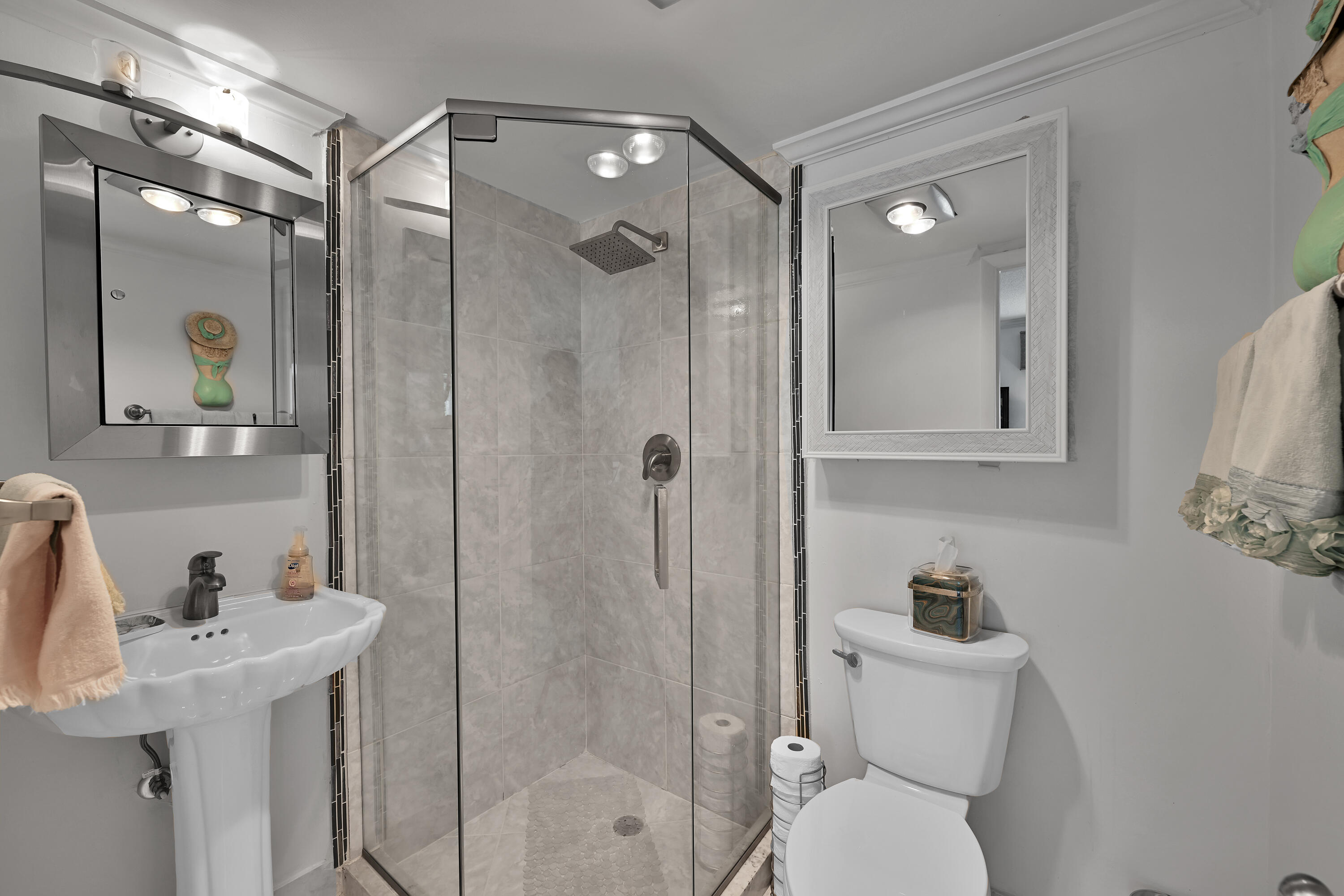 13791 Flora Place, Unit D Delray Beach, FL 33484 - Photo 21 of 24 a bathroom with a sink toilet and shower