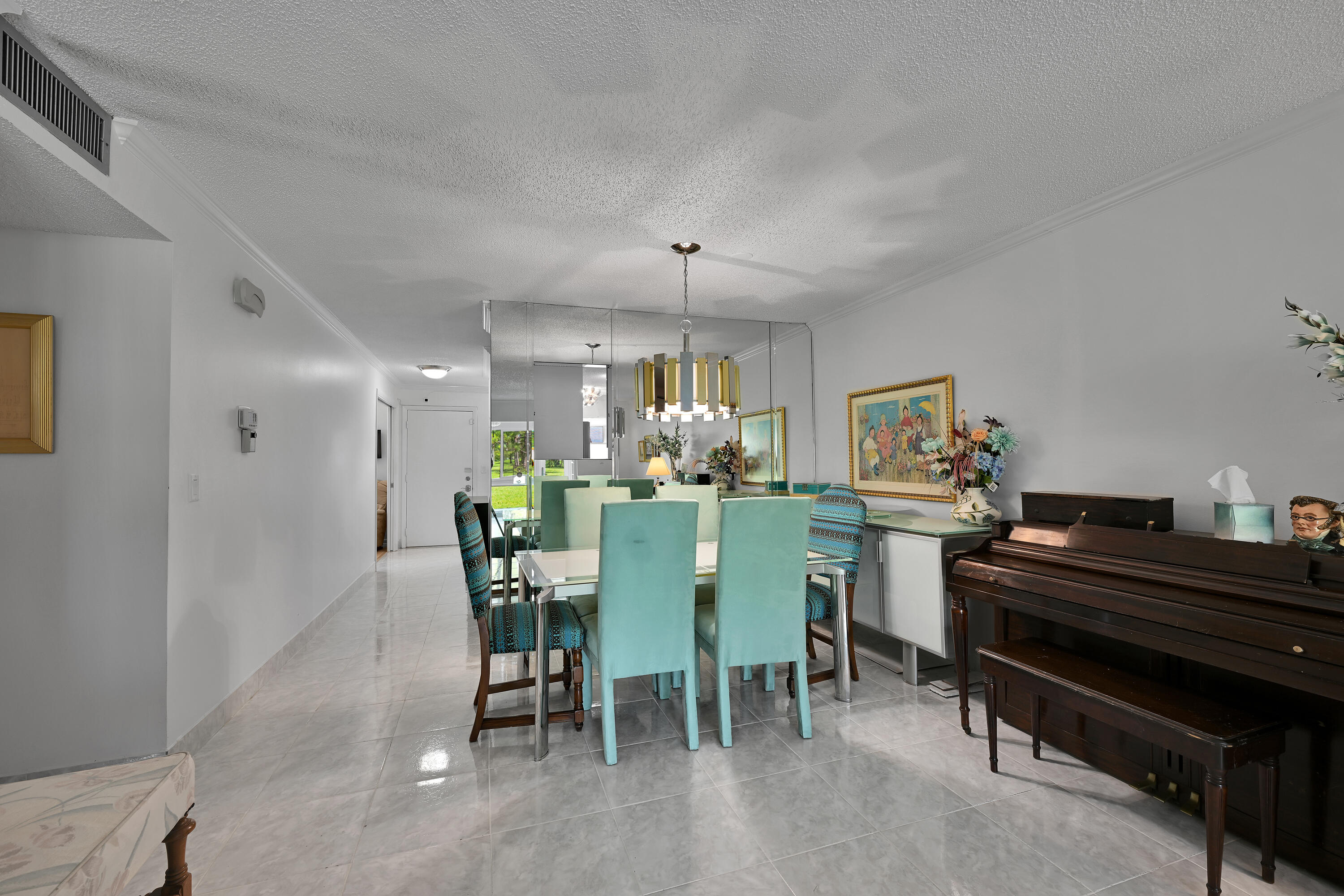 13791 Flora Place, Unit D Delray Beach, FL 33484 - Photo 7 of 24 a dining room with furniture and window