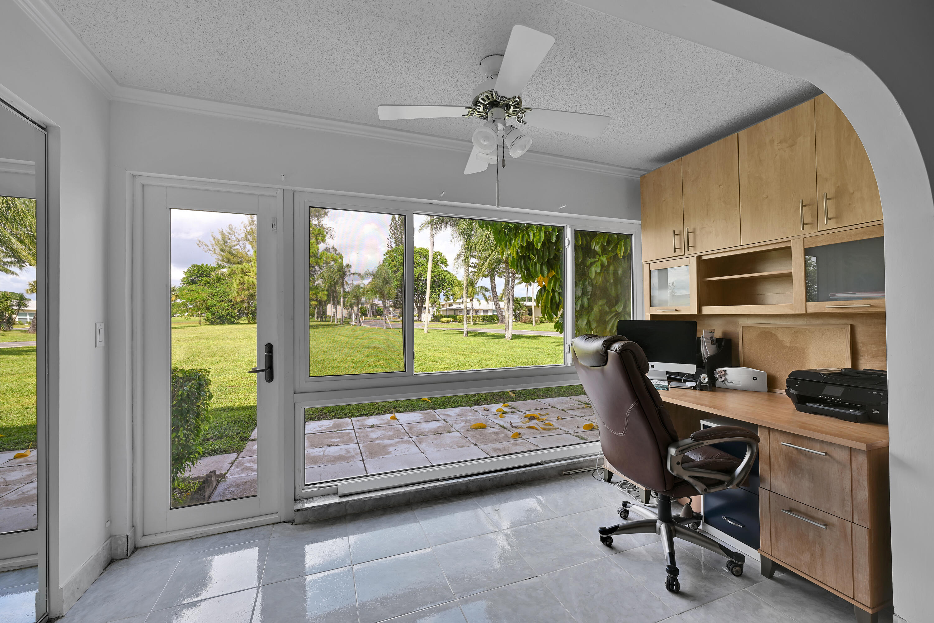 13791 Flora Place, Unit D Delray Beach, FL 33484 - Photo 10 of 24 a view of a workspace with furniture and a window