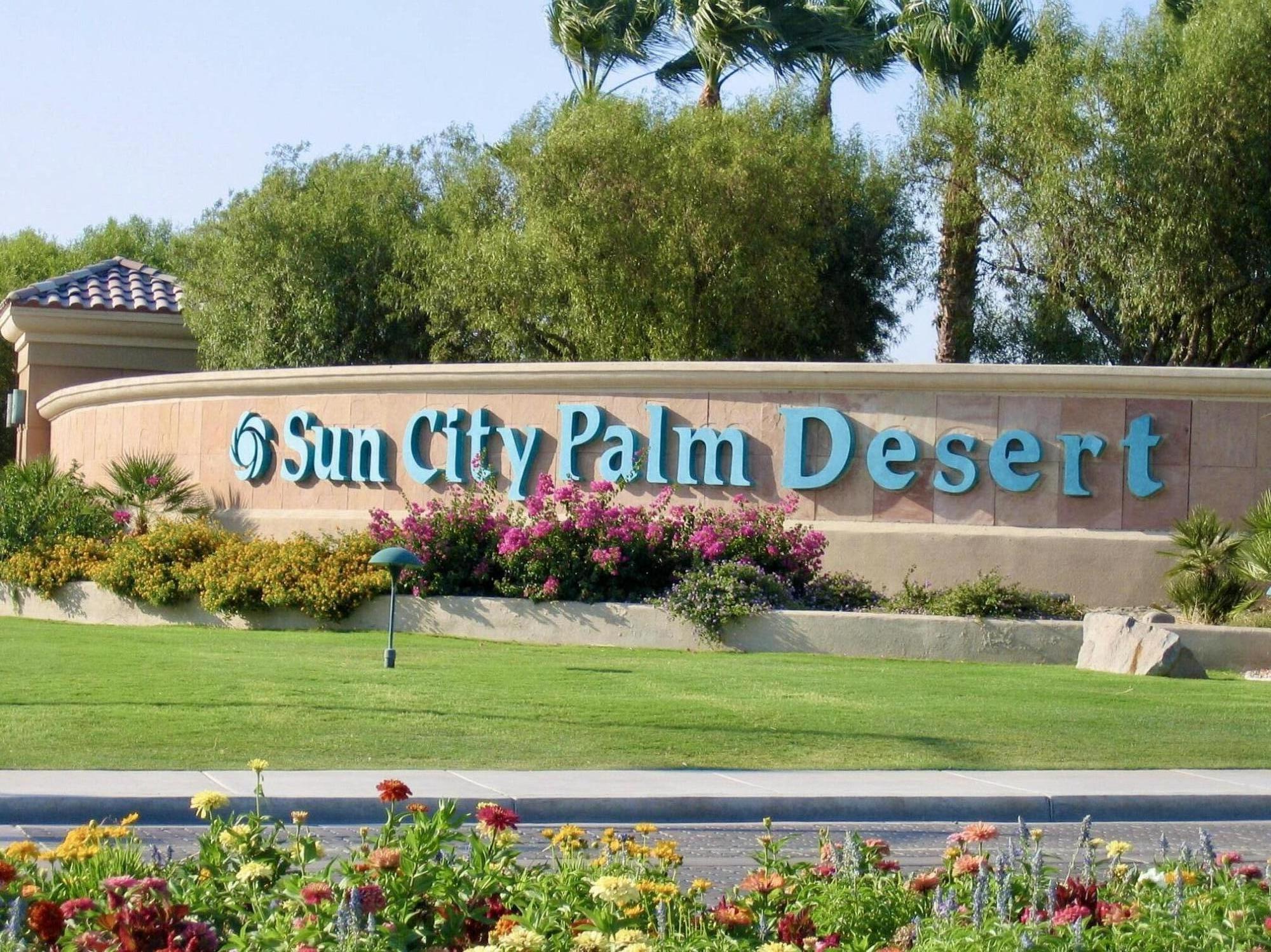 78376 Moongold Road Palm Desert, CA 92211 - Photo 18 of 36 a sign on the side of a building