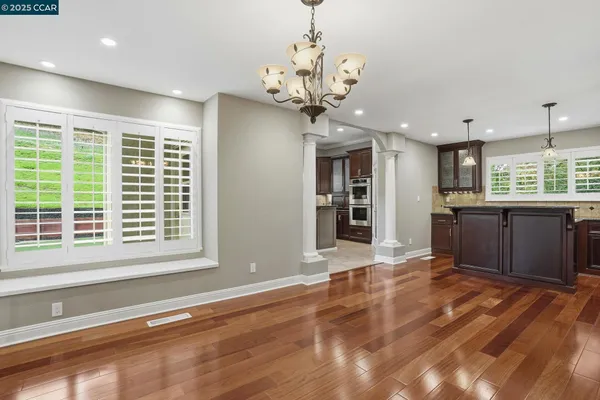 a view of an empty room with a ceiling fan