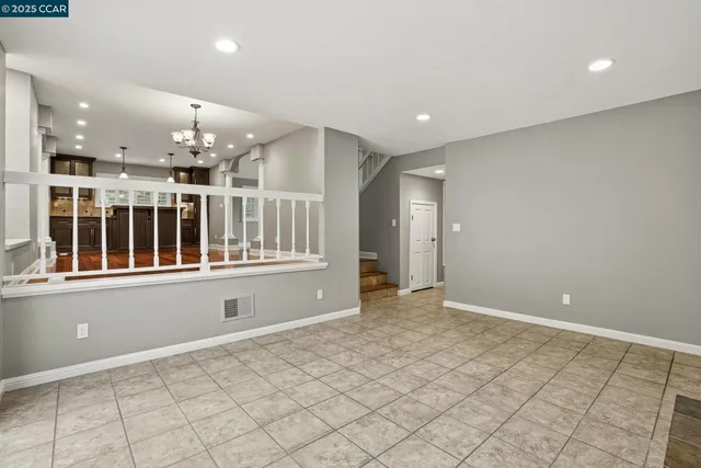 a living room with furniture a fireplace and a large window