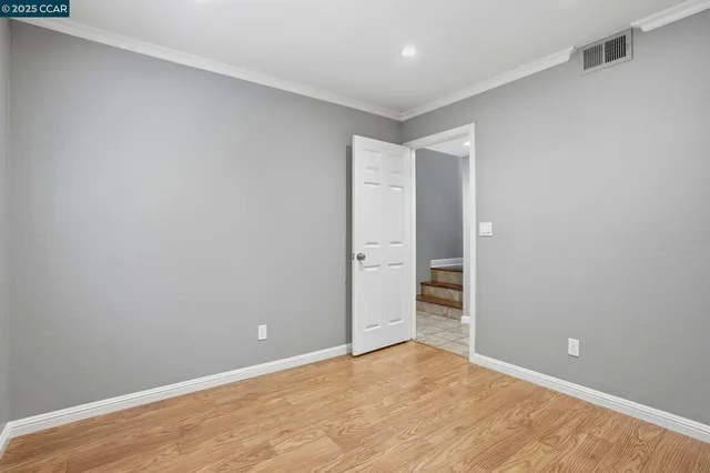 a front view of a house with a garden and patio