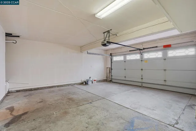 an aerial view of a house with a yard and plants