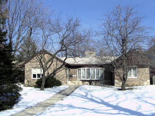408 North Delaplaine Road Riverside, IL 60546 - Photo 1 of 1 a view of a house with a yard covered in snow