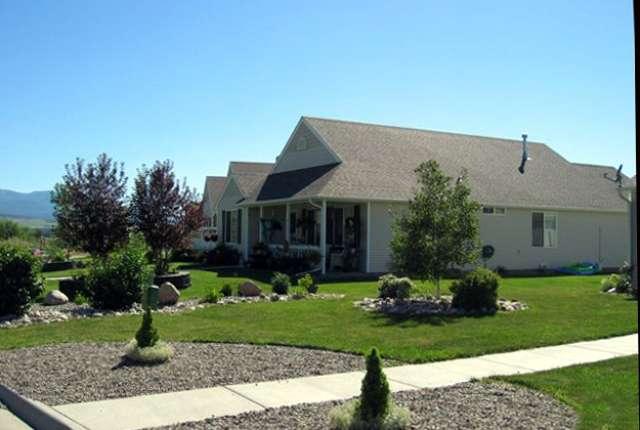 2757 Acacia Avenue Rifle, CO 81650 - Photo 2 of 9 a front view of a house with a garden