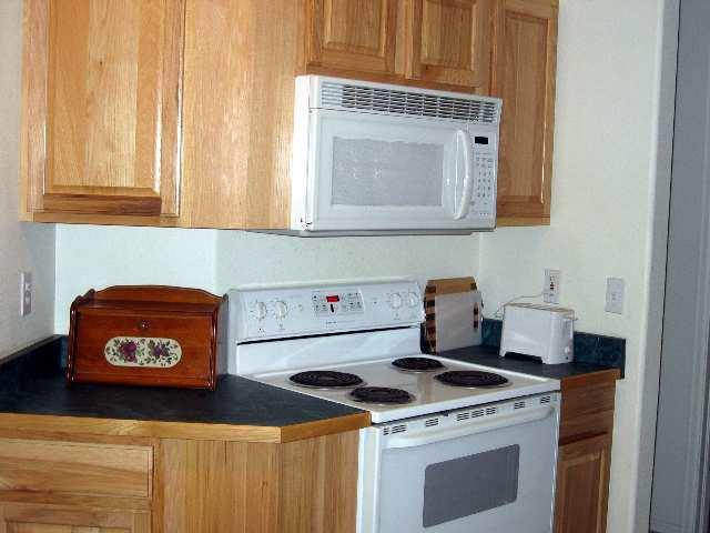 2757 Acacia Avenue Rifle, CO 81650 - Photo 6 of 9 a kitchen with a stove and a microwave