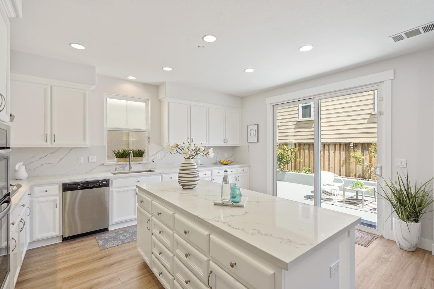 115 Cypress Street Pacifica, CA 94044 - Photo 17 of 59 a kitchen with sink stove and cabinets