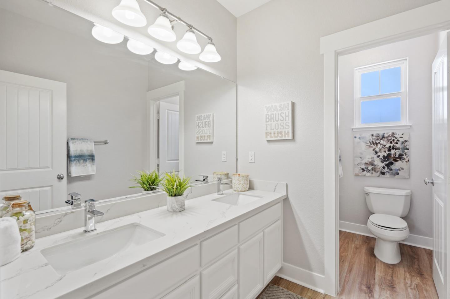 115 Cypress Street Pacifica, CA 94044 - Photo 25 of 59 a bathroom with a sink a toilet and a large mirror