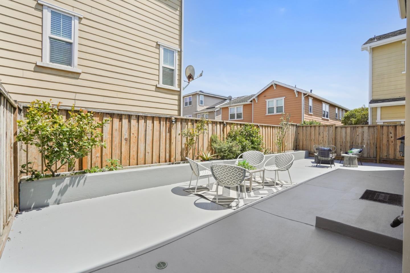 115 Cypress Street Pacifica, CA 94044 - Photo 43 of 59 a view of a patio with couches table and chairs and potted plants