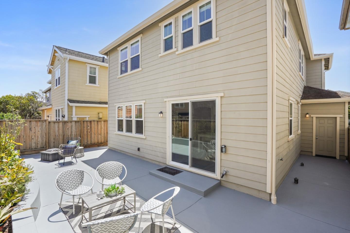 115 Cypress Street Pacifica, CA 94044 - Photo 45 of 59 a backyard of a house with table and chairs