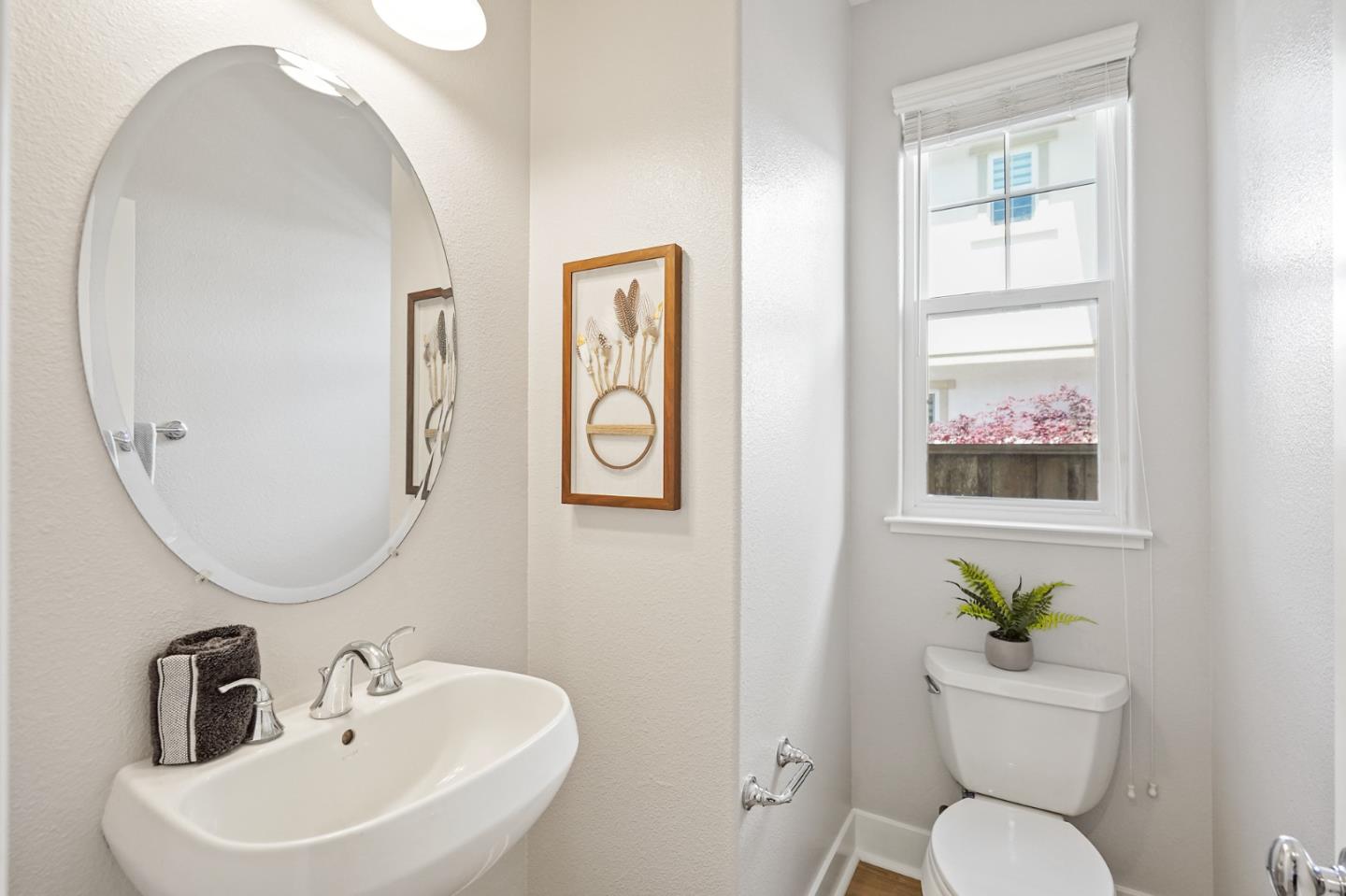 115 Cypress Street Pacifica, CA 94044 - Photo 7 of 59 a bathroom with a toilet a sink and mirror