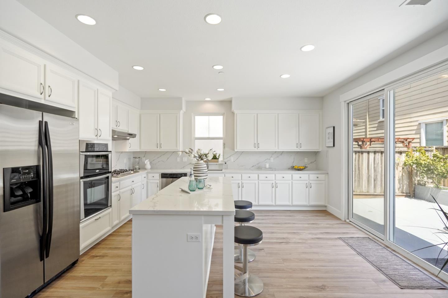 115 Cypress Street Pacifica, CA 94044 - Photo 10 of 59 a large kitchen with lots of counter space and stainless steel appliances