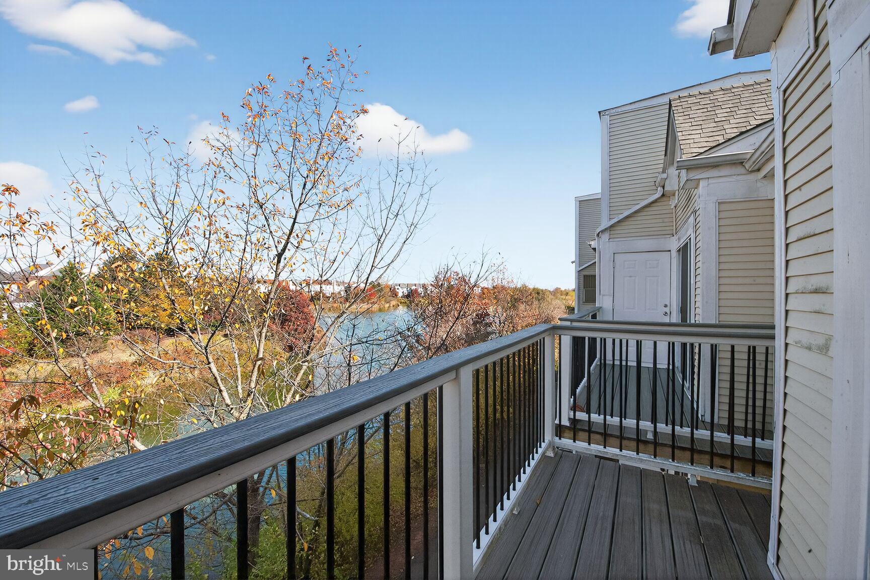 44084 Natalie Terrace, Unit 301 Ashburn, VA 20147 - Photo 14 of 15 a view of balcony with wooden floor