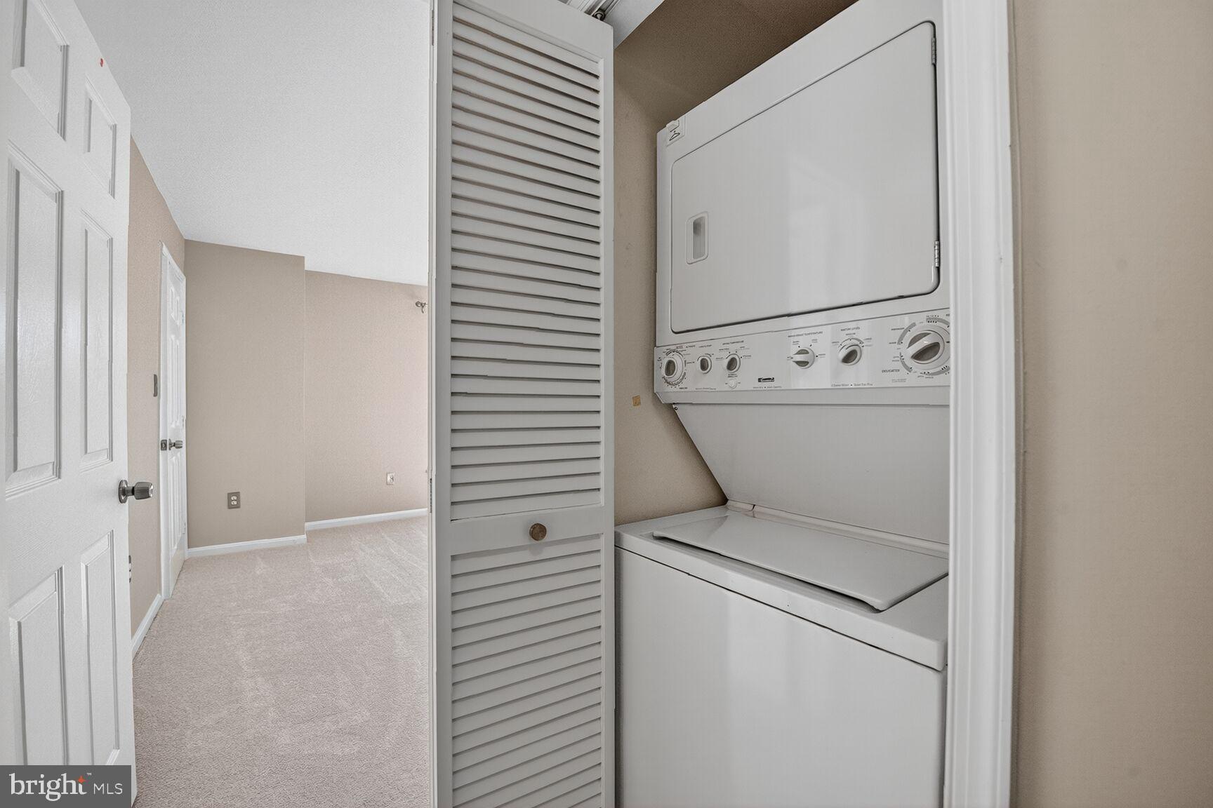 44084 Natalie Terrace, Unit 301 Ashburn, VA 20147 - Photo 10 of 15 a utility room with dryer and washer