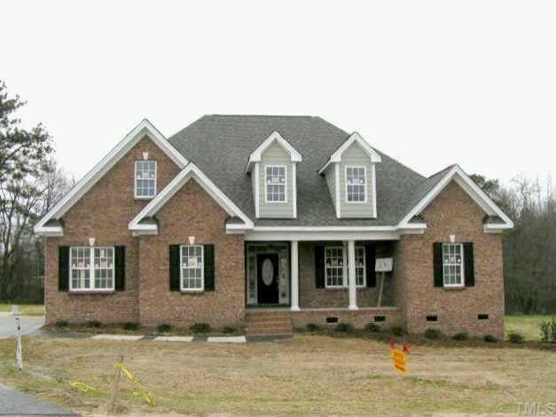 1045 Newburgh Circle Raleigh, NC 27603 - Photo 1 of 1 a front view of a house with a yard