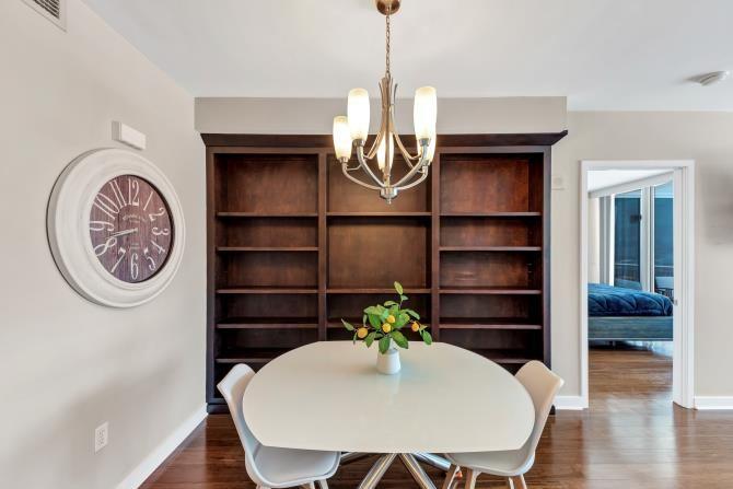 a view of a room that has a table and a chair