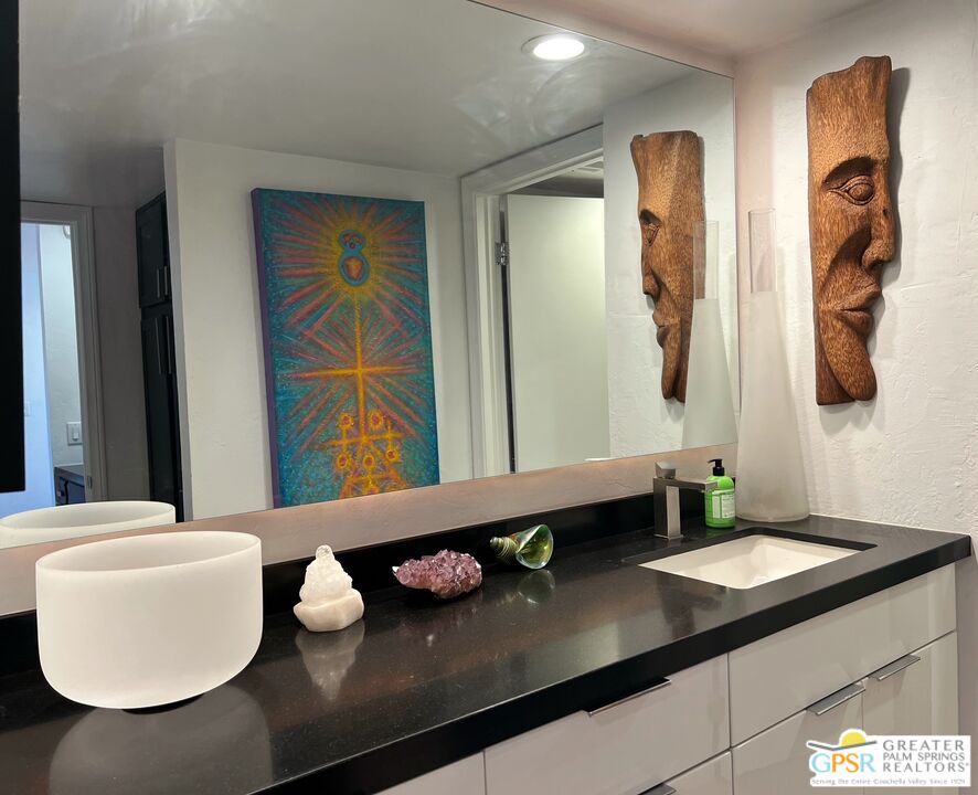 1050 Ramon Road, Unit 83 Palm Springs, CA 92264 - Photo 10 of 32 a bathroom with a sink and a mirror