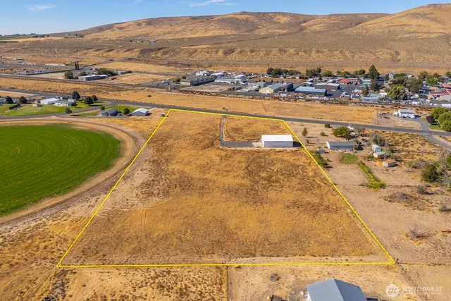 an aerial view of residential building and ocean view