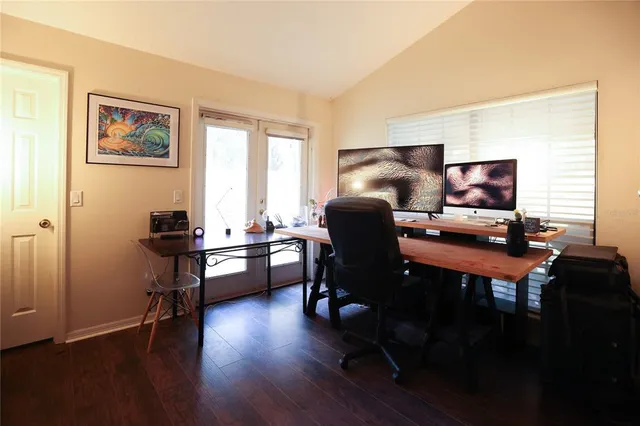 a view of a livingroom with furniture window and wooden floor
