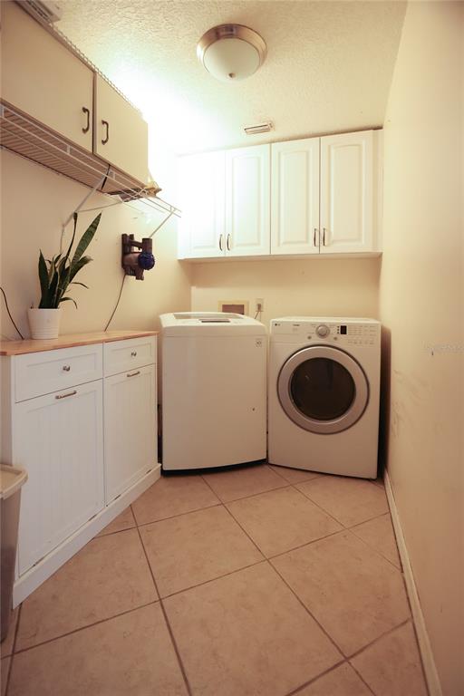 11923 Lake Butler Boulevard Windermere, FL 34786 - Photo 25 of 31 a utility room with dryer and washer