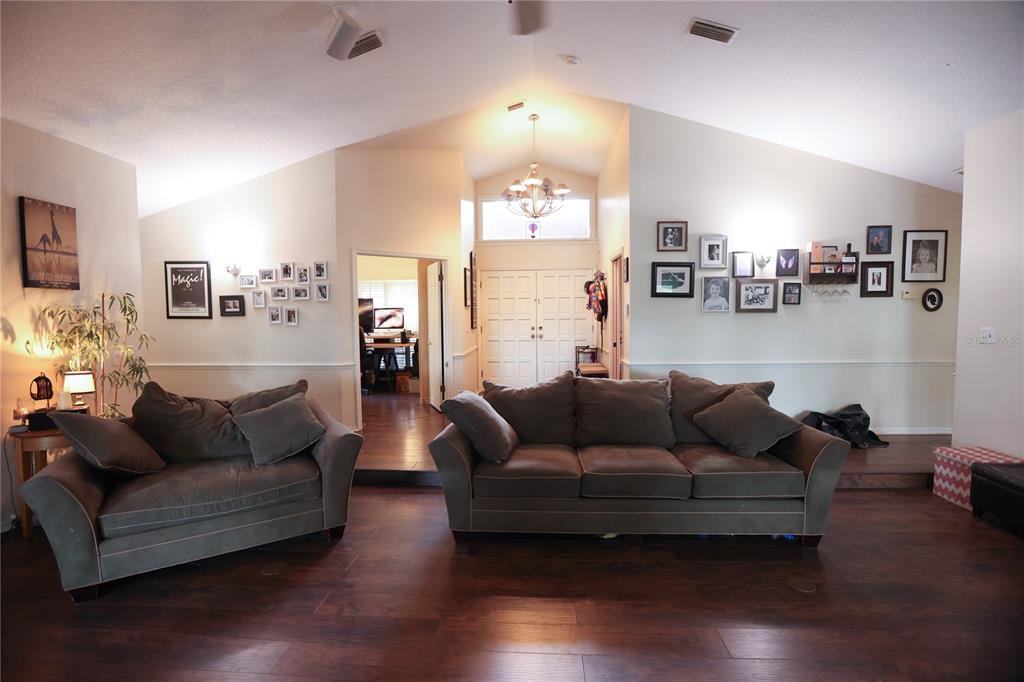 11923 Lake Butler Boulevard Windermere, FL 34786 - Photo 5 of 31 a living room with furniture and a wooden floor