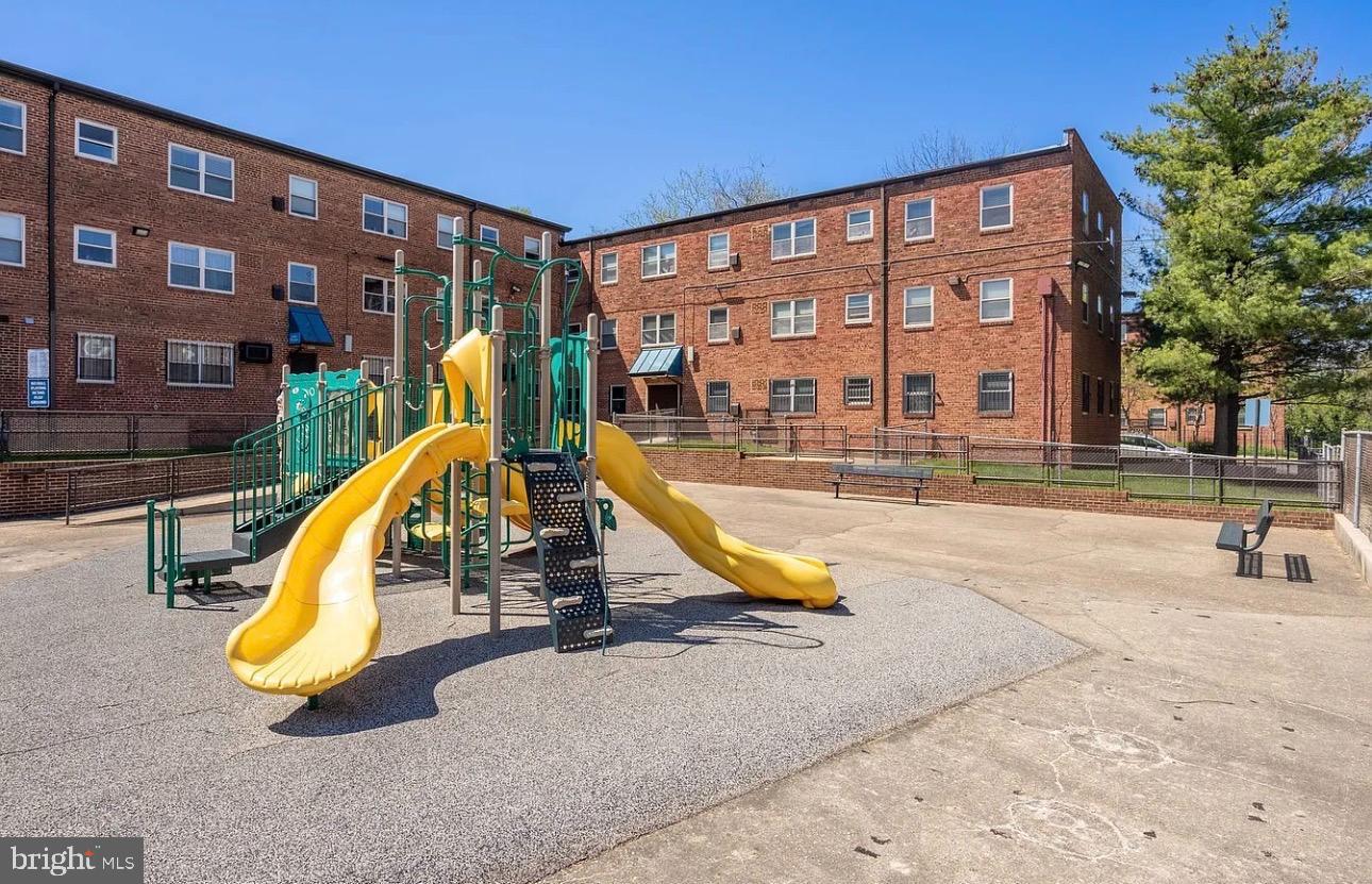 2655 Birney Place Southeast, Unit 101 Washington, DC 20020 - Photo 17 of 33 a view of a swimming pool with a lounge chairs