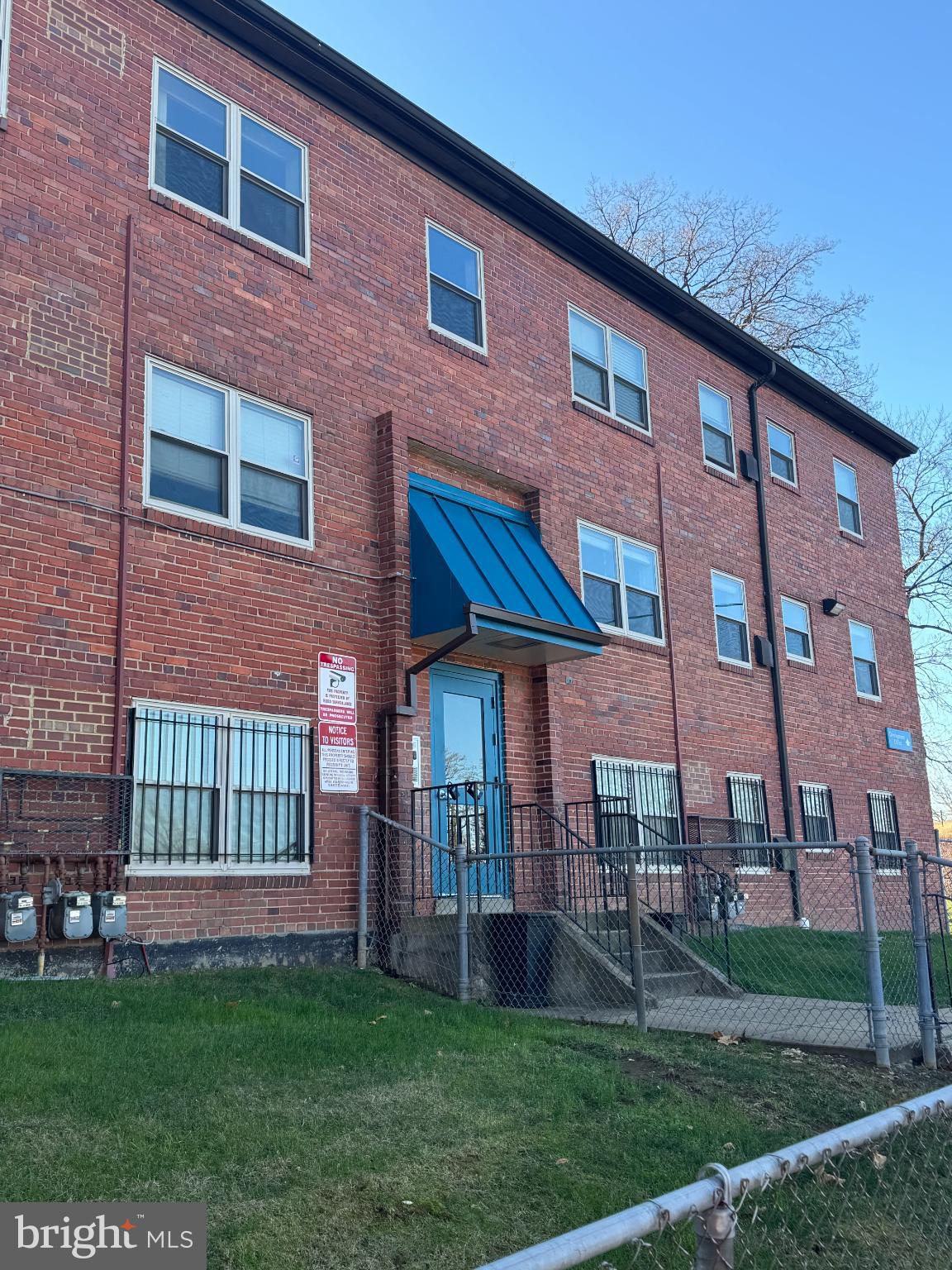 2655 Birney Place Southeast, Unit 101 Washington, DC 20020 - Photo 2 of 33 a brick building that has a lots of windows in it