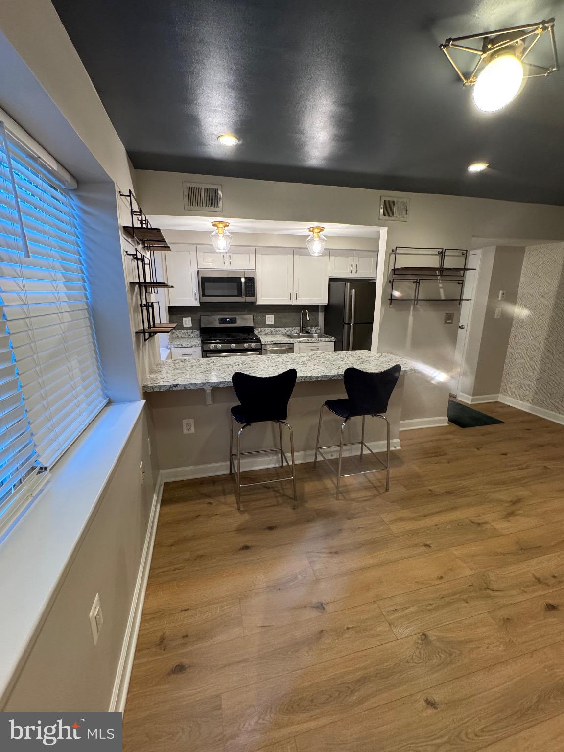 2655 Birney Place Southeast, Unit 101 Washington, DC 20020 - Photo 21 of 33 a living room with a couch and a coffee table