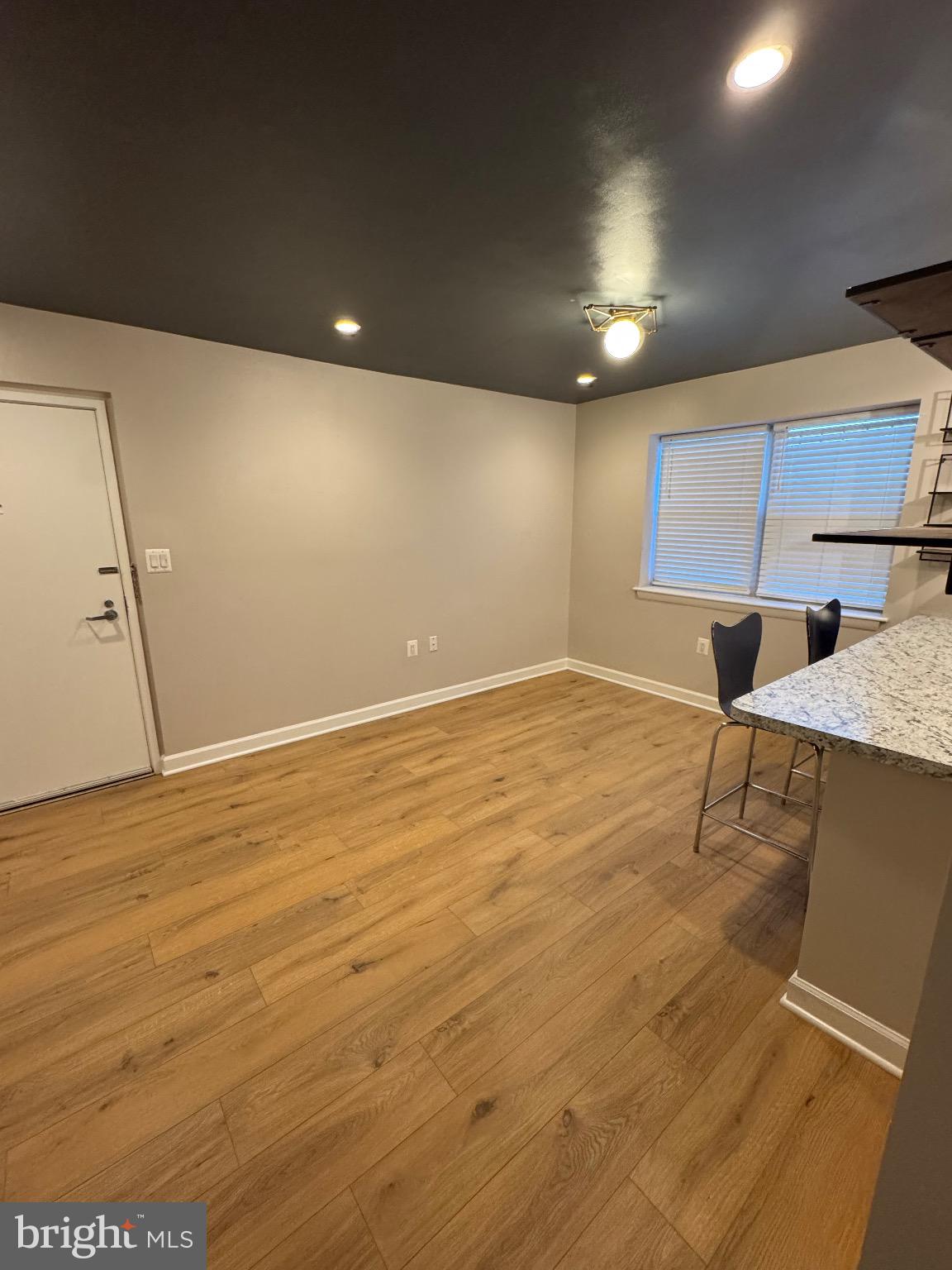 2655 Birney Place Southeast, Unit 101 Washington, DC 20020 - Photo 23 of 33 a view of room with wooden floor