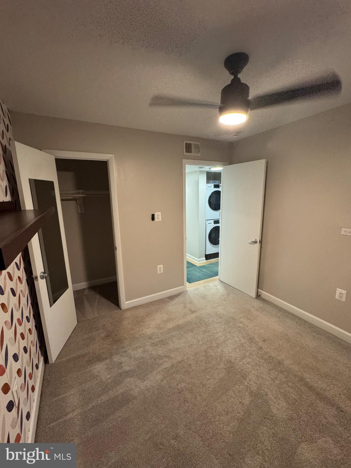 2655 Birney Place Southeast, Unit 101 Washington, DC 20020 - Photo 28 of 33 en empty room with windows and entrance
