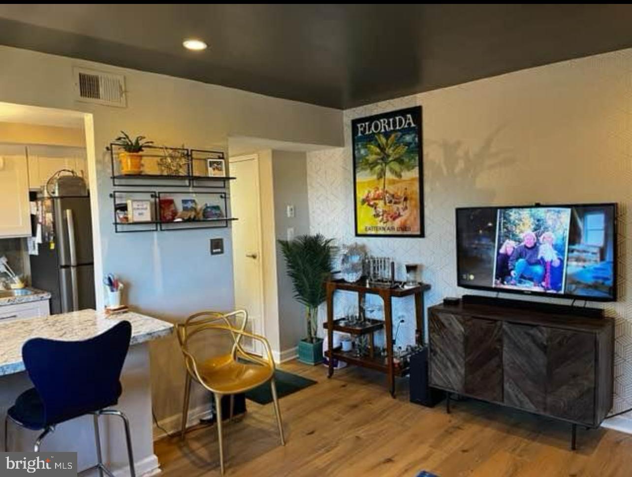 2655 Birney Place Southeast, Unit 101 Washington, DC 20020 - Photo 3 of 33 a view of a livingroom with furniture and lounge chair