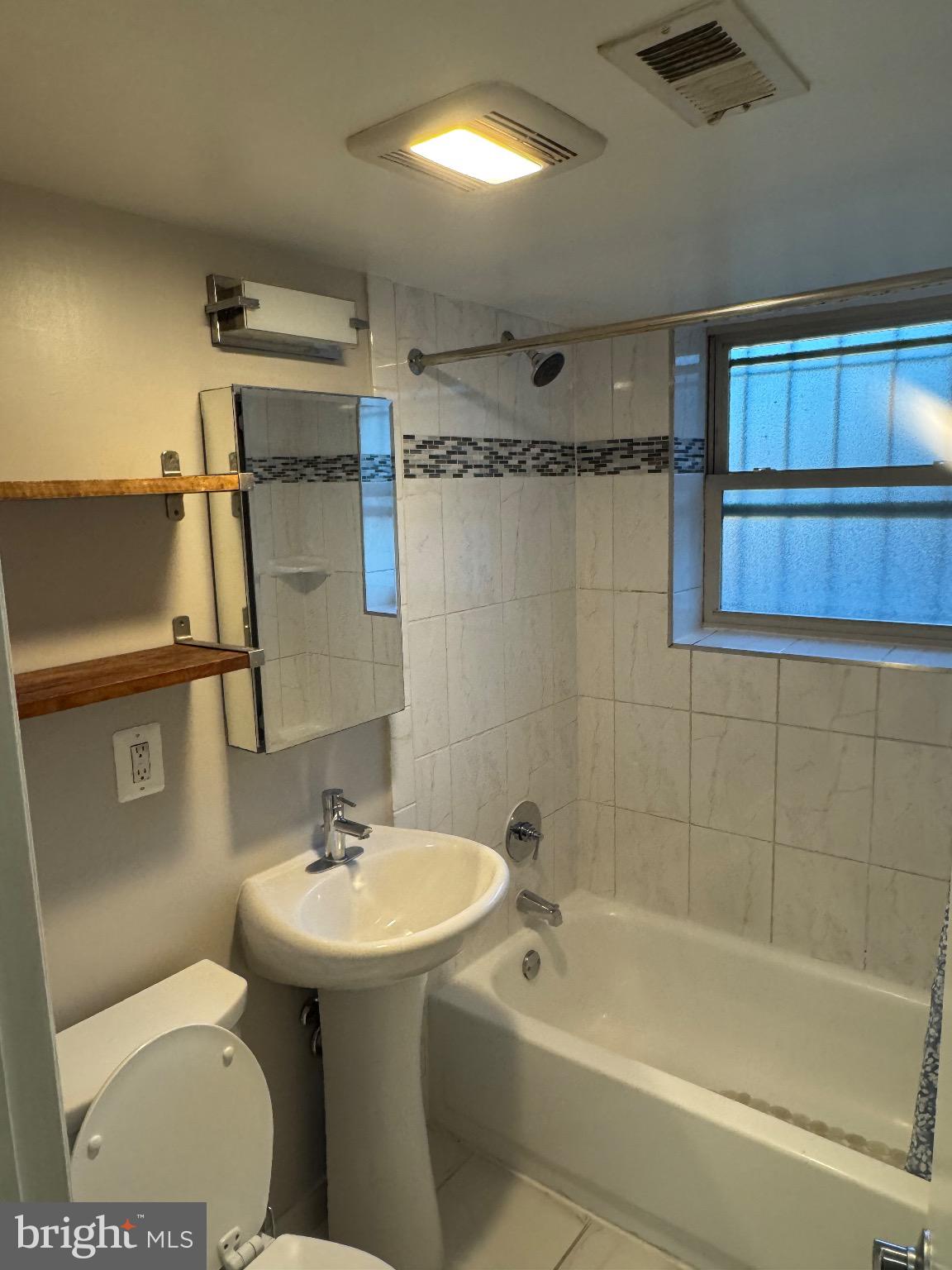 2655 Birney Place Southeast, Unit 101 Washington, DC 20020 - Photo 31 of 33 a bathroom with a sink toilet and shower