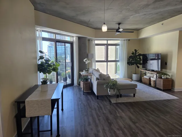a living room with furniture and a large window