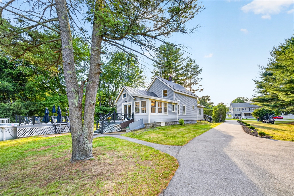24 Miller Road Wilmington, MA 01887 - Photo 39 of 40 a view of a house with garden and a tree