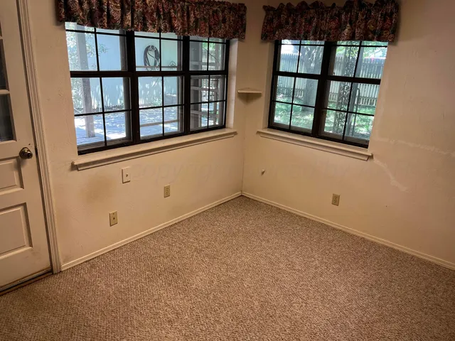 an empty room with windows