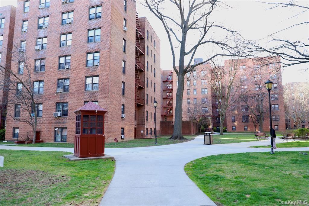 150-29 72nd Road, Unit 5C Queens, NY 11367 - Photo 20 of 34 a view of a building with a yard