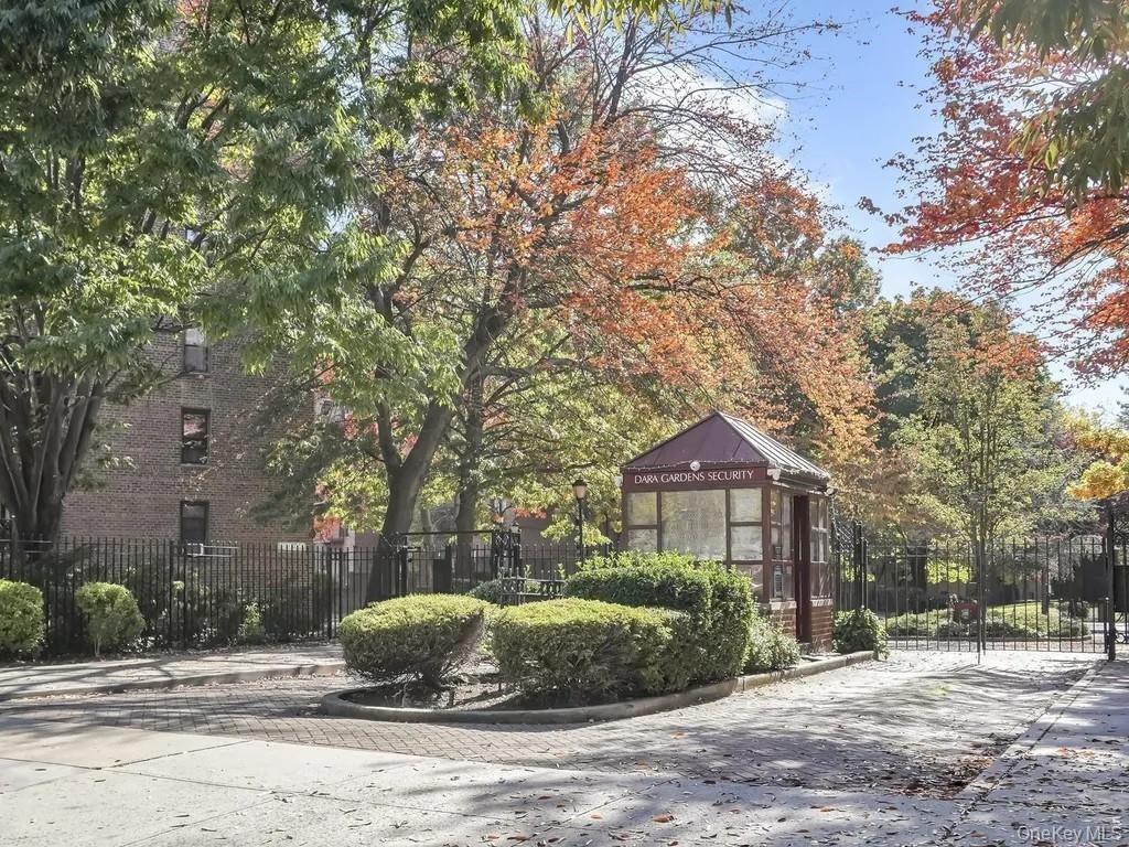150-29 72nd Road, Unit 5C Queens, NY 11367 - Photo 30 of 34 a front view of a house with a yard