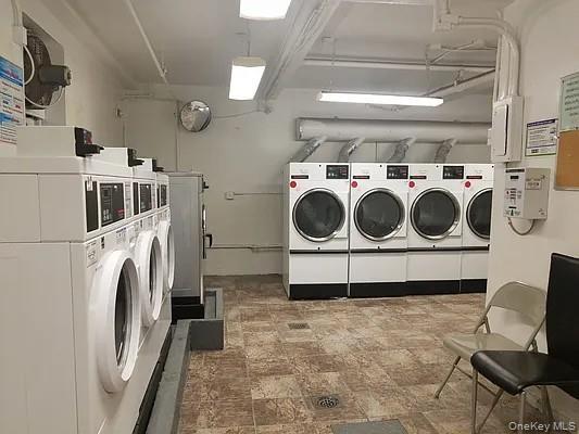 150-29 72nd Road, Unit 5C Queens, NY 11367 - Photo 34 of 34 a utility room with dryer and washer
