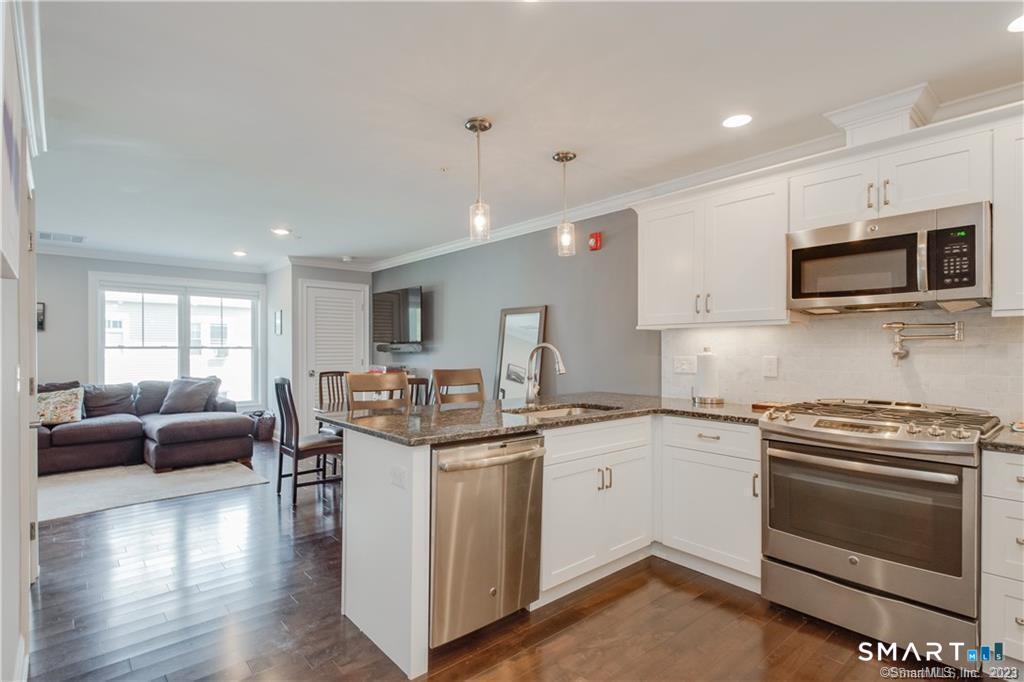 2 Bishop Road, Unit 201 West Hartford, CT 06119 - Photo 6 of 26 Kitchen with granite counters and stainless steel appliances