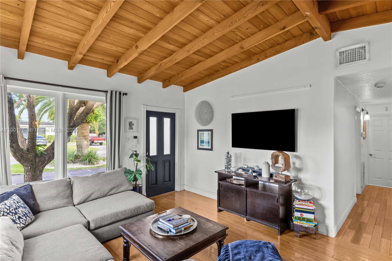 5344 Southwest 90th Court Miami, FL 33165 - Photo 2 of 13 a living room with furniture and a flat screen tv