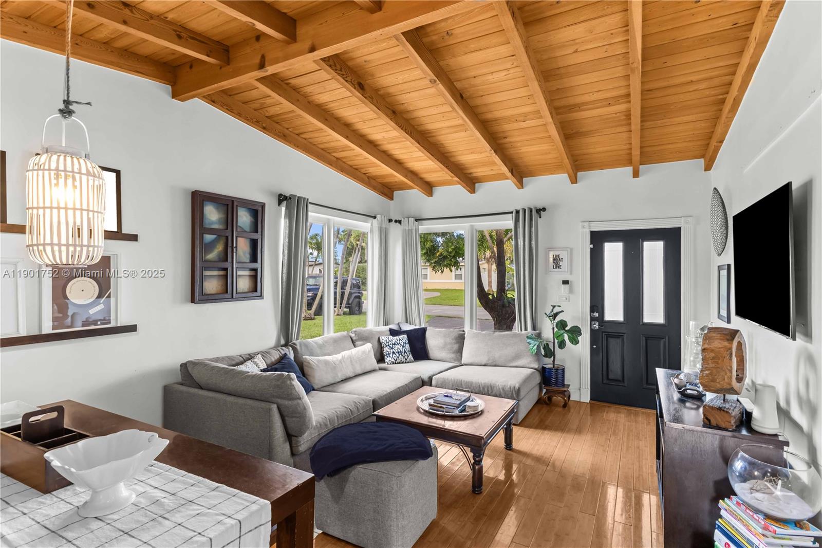 5344 Southwest 90th Court Miami, FL 33165 - Photo 3 of 13 a living room with furniture and a flat screen tv