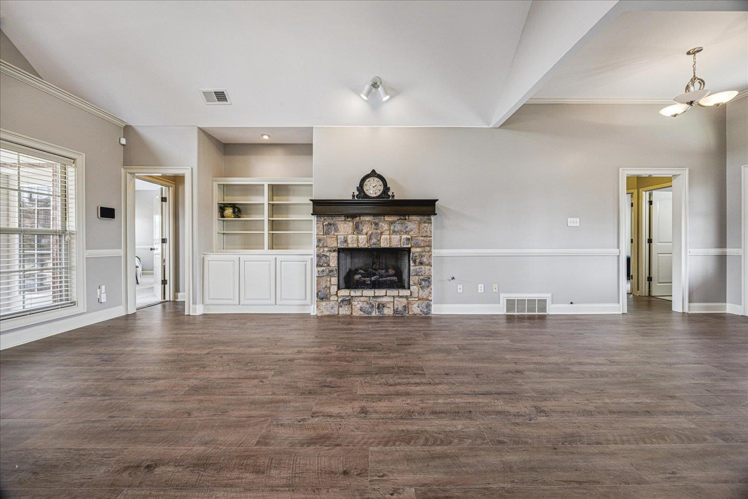 New STAINMASTER® LVP, gas fireplace, built-in bookcase
