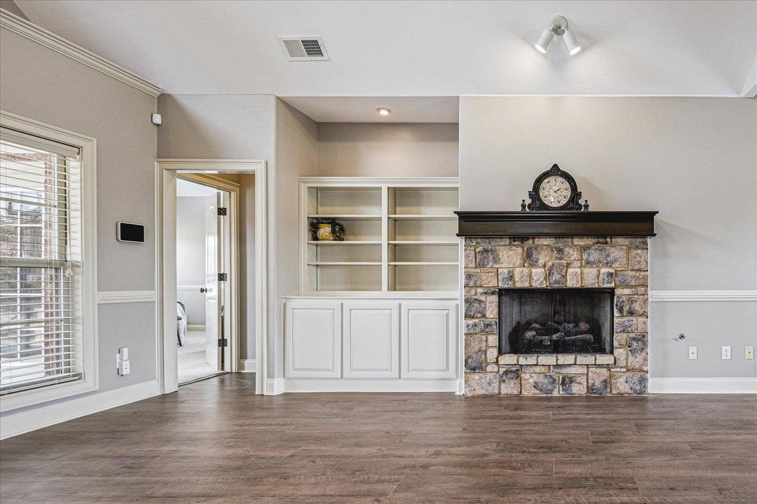 142 Clementine Road Atoka, TN 38004 - Photo 8 of 37 Gas Fireplace, Built-In Bookcase, New LVP Stainmaster Flooring