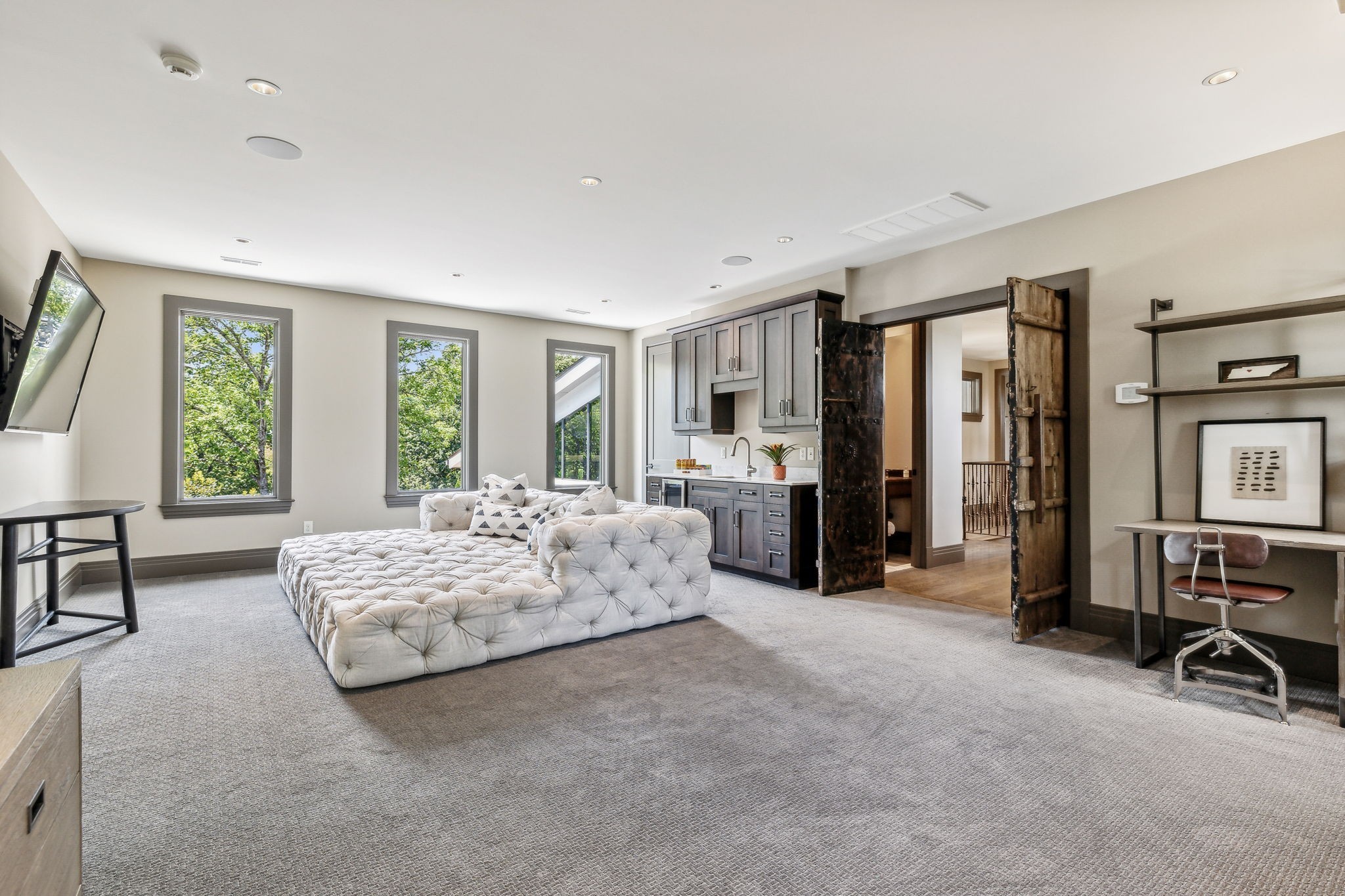 3401 Trimble Road Nashville, TN 37215 - Photo 40 of 55 a spacious bedroom with a bed a table and large windows