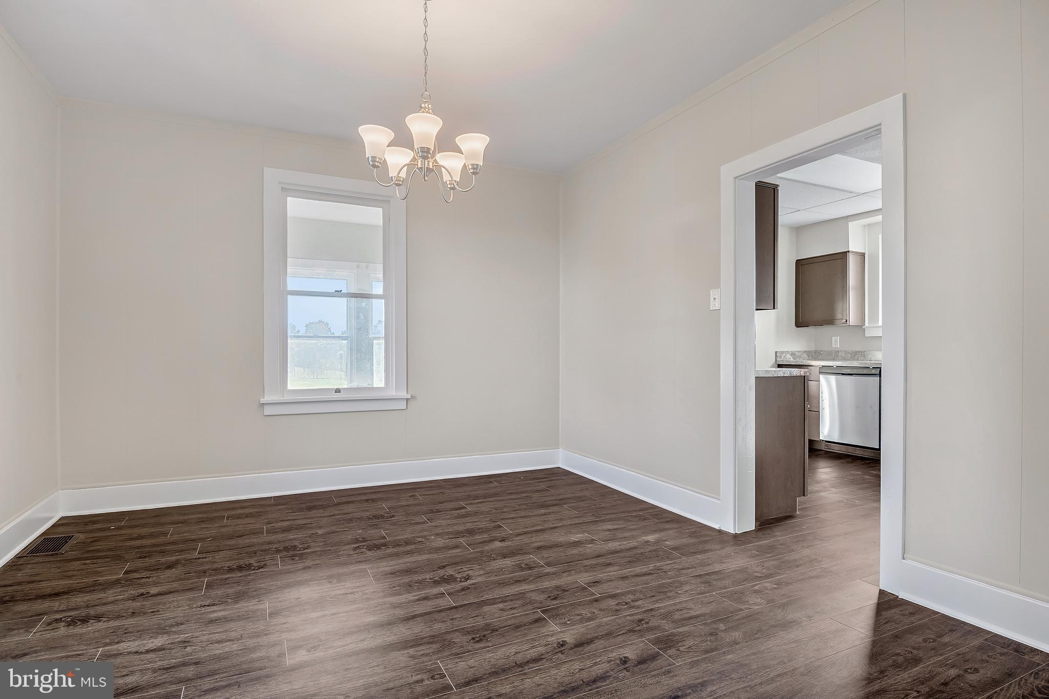 206 Hershey Road Hummelstown, PA 17036 - Photo 7 of 26 a view of a room with wooden floor and a window