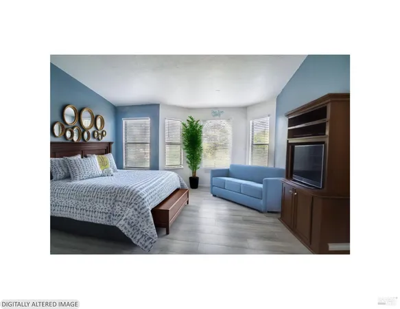 a bedroom with a bed and furniture