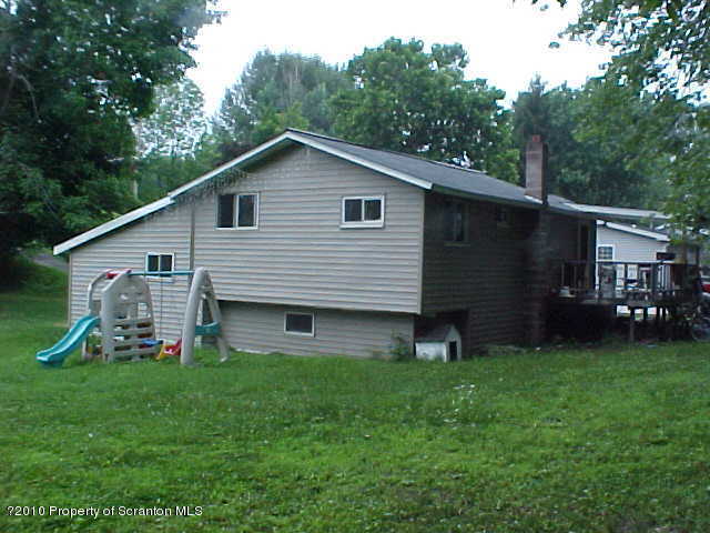 40 Orchard Road Great Bend, PA 18821 - Photo 3 of 8 a front view of a house with garden